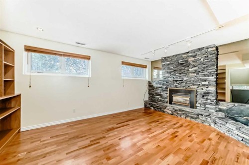 540 Dalmeny Hill Nw, Calgary, AB - Indoor Photo Showing Living Room With Fireplace