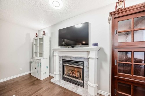115 West Lakeview Circle, Chestermere, AB - Indoor Photo Showing Living Room With Fireplace