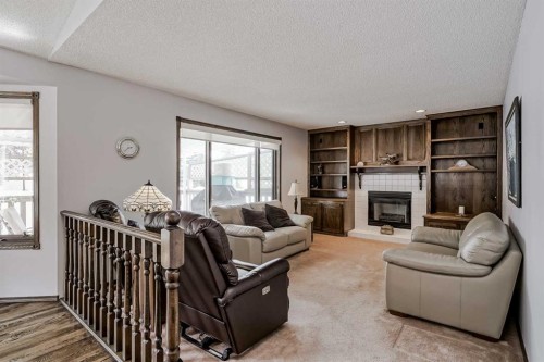 14319 Evergreen Street Sw, Calgary, AB - Indoor Photo Showing Living Room With Fireplace