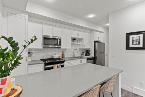 1402-100 Walgrove Court Se, Calgary, AB - Indoor Photo Showing Kitchen With Stainless Steel Kitchen With Double Sink