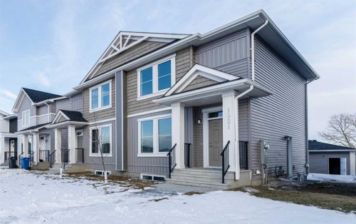 1921 Mccaskill Drive, Crossfield, AB - Outdoor With Facade