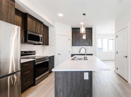 1921 Mccaskill Drive, Crossfield, AB - Indoor Photo Showing Kitchen With Double Sink With Upgraded Kitchen