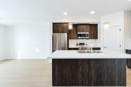 1921 Mccaskill Drive, Crossfield, AB - Indoor Photo Showing Kitchen With Double Sink With Upgraded Kitchen