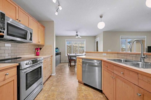 19 Copperfield Crescent Se, Calgary, AB - Indoor Photo Showing Kitchen With Double Sink