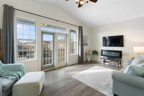 47 Copperstone Mews Se, Calgary, AB - Indoor Photo Showing Living Room With Fireplace