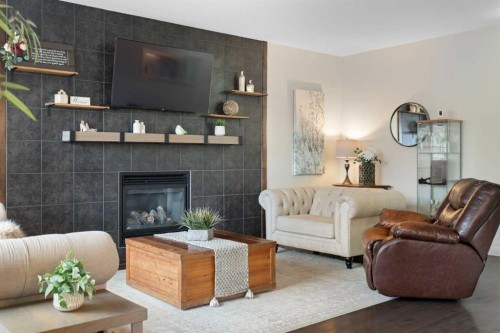 47 Copperstone Mews Se, Calgary, AB - Indoor Photo Showing Living Room With Fireplace