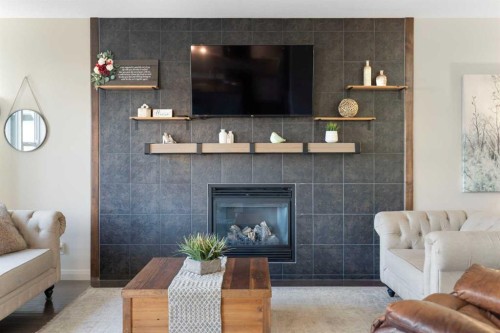 47 Copperstone Mews Se, Calgary, AB - Indoor Photo Showing Living Room With Fireplace