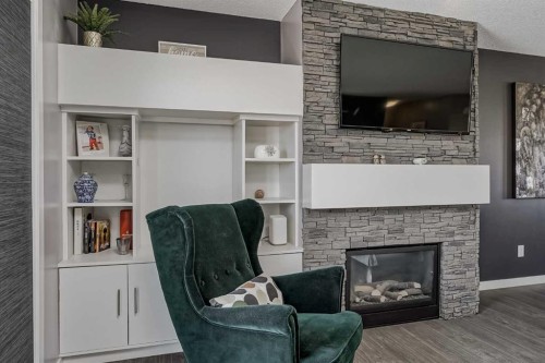313 Copperpond Landing Se, Calgary, AB - Indoor Photo Showing Living Room With Fireplace