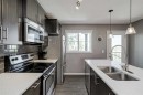 313 Copperpond Landing Se, Calgary, AB  - Indoor Photo Showing Kitchen With Double Sink 