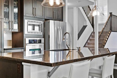 129 Springbluff Boulevard Sw, Calgary, AB - Indoor Photo Showing Kitchen With Upgraded Kitchen