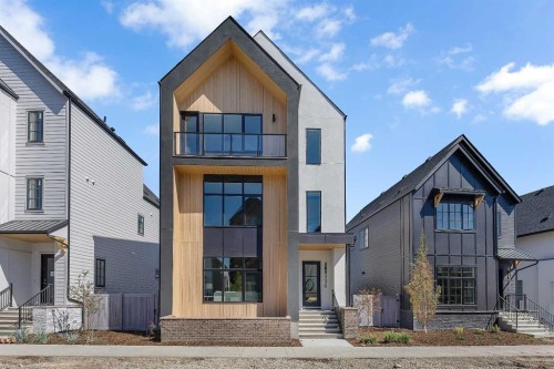 336 Normandy Drive Sw, Calgary, AB - Outdoor With Facade