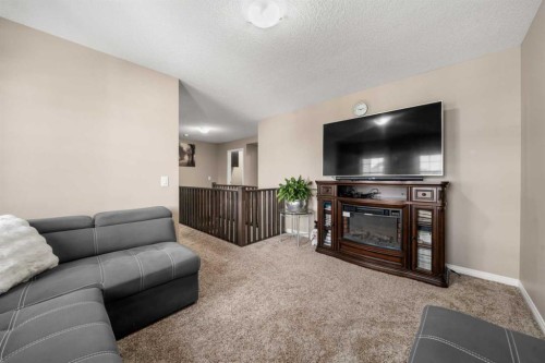 353 Windrow Crescent Sw, Airdrie, AB - Indoor Photo Showing Living Room