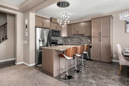 353 Windrow Crescent Sw, Airdrie, AB - Indoor Photo Showing Kitchen With Upgraded Kitchen