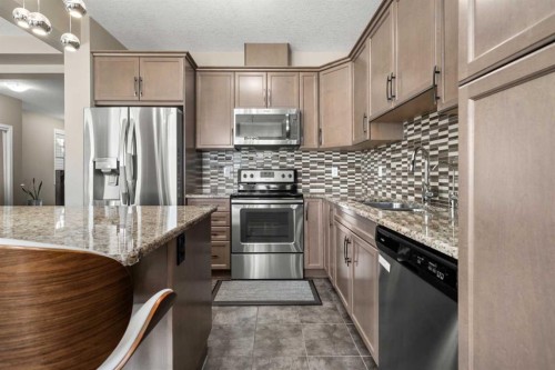 353 Windrow Crescent Sw, Airdrie, AB - Indoor Photo Showing Kitchen With Double Sink With Upgraded Kitchen