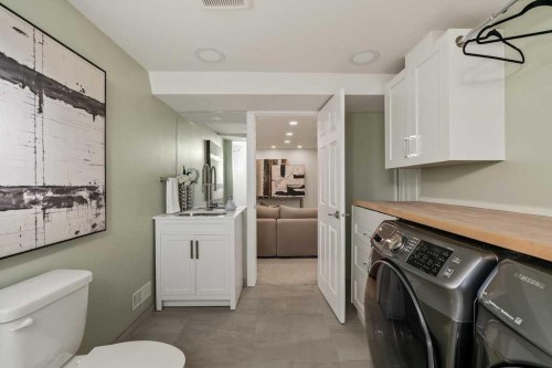 1571 Windsor Street Nw, Calgary, AB - Indoor Photo Showing Laundry Room