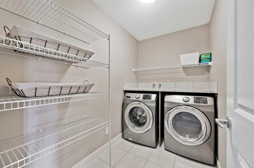 13 Cranbrook Cove Se, Calgary, AB - Indoor Photo Showing Laundry Room