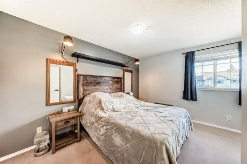 8-122 Bow Ridge Crescent, Cochrane, AB - Indoor Photo Showing Bedroom