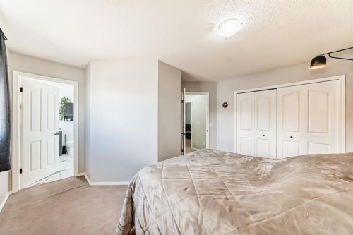 8-122 Bow Ridge Crescent, Cochrane, AB - Indoor Photo Showing Bedroom