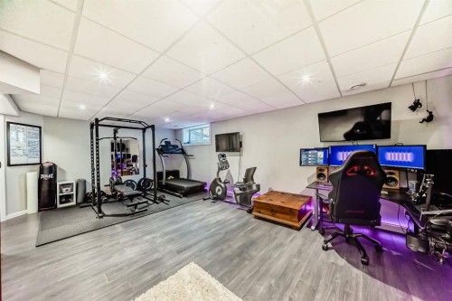 8-122 Bow Ridge Crescent, Cochrane, AB - Indoor Photo Showing Gym Room