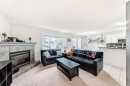 8-122 Bow Ridge Crescent, Cochrane, AB  - Indoor Photo Showing Living Room With Fireplace 