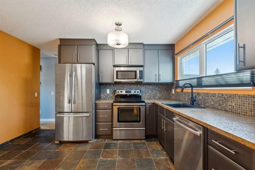 5423 Madigan Drive Ne, Calgary, AB - Indoor Photo Showing Kitchen With Stainless Steel Kitchen