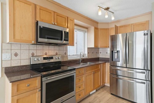 30 Falmere Way Ne, Calgary, AB - Indoor Photo Showing Kitchen With Double Sink
