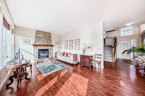 68 Strathlea Close Sw, Calgary, AB - Indoor Photo Showing Living Room With Fireplace