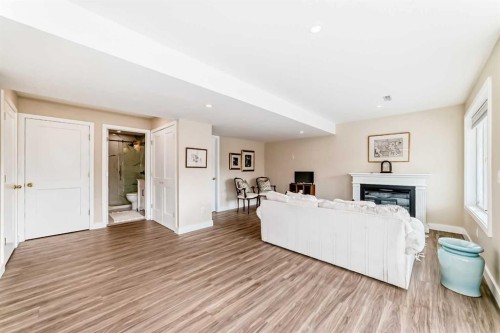 68 Strathlea Close Sw, Calgary, AB - Indoor Photo Showing Living Room With Fireplace