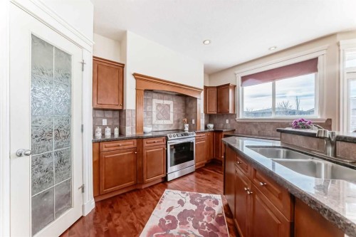 68 Strathlea Close Sw, Calgary, AB - Indoor Photo Showing Kitchen With Double Sink