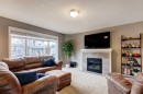 207 Cranford Crescent Se, Calgary, AB  - Indoor Photo Showing Living Room With Fireplace 