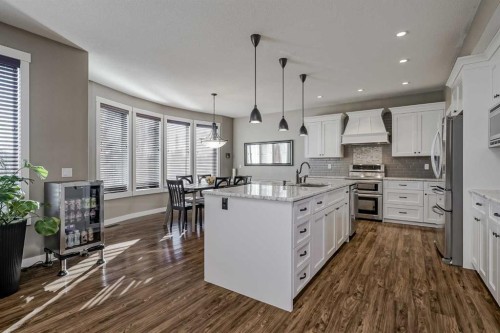60 Sheep River Heights, Okotoks, AB - Indoor Photo Showing Kitchen With Upgraded Kitchen
