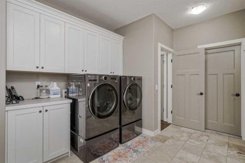 60 Sheep River Heights, Okotoks, AB - Indoor Photo Showing Laundry Room