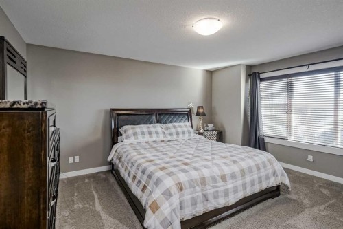60 Sheep River Heights, Okotoks, AB - Indoor Photo Showing Bedroom