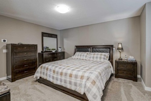 60 Sheep River Heights, Okotoks, AB - Indoor Photo Showing Bedroom