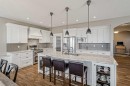 60 Sheep River Heights, Okotoks, AB  - Indoor Photo Showing Kitchen With Upgraded Kitchen 