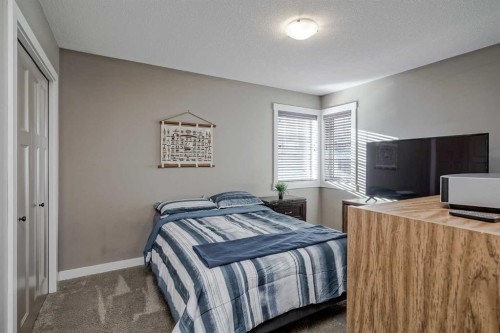 60 Sheep River Heights, Okotoks, AB - Indoor Photo Showing Bedroom