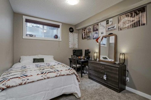 60 Sheep River Heights, Okotoks, AB - Indoor Photo Showing Bedroom