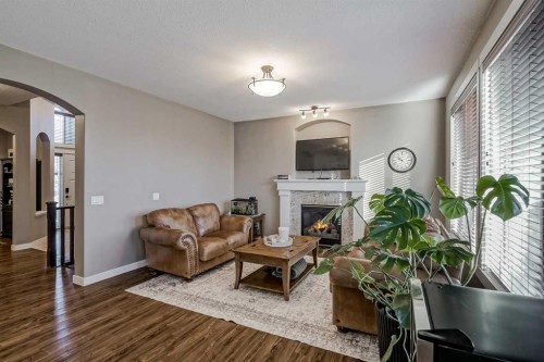 60 Sheep River Heights, Okotoks, AB - Indoor Photo Showing Living Room With Fireplace