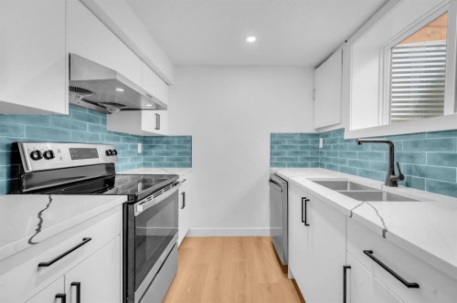 3229 Doverville Crescent Se, Calgary, AB - Indoor Photo Showing Kitchen With Double Sink With Upgraded Kitchen