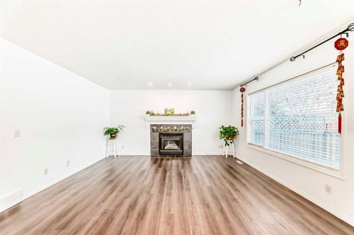 71 Millrise Square Sw, Calgary, AB - Indoor Photo Showing Living Room With Fireplace