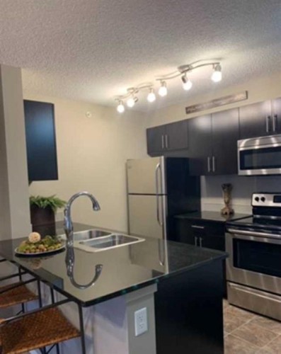 3416-81 Legacy Boulevard Se, Calgary, AB - Indoor Photo Showing Kitchen With Stainless Steel Kitchen With Double Sink