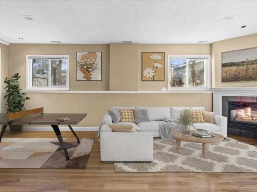 107 Woodford Crescent Sw, Calgary, AB - Indoor Photo Showing Living Room With Fireplace
