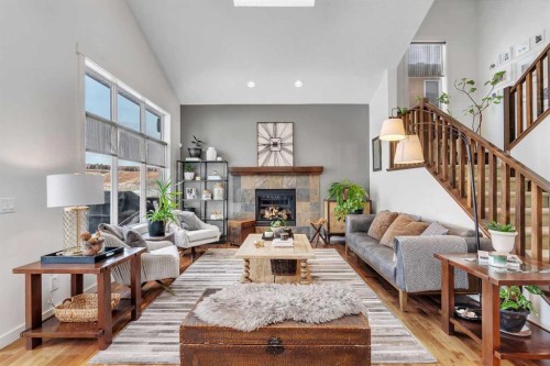 505 Discovery Ridge Boulevard Sw, Calgary, AB - Indoor Photo Showing Living Room With Fireplace