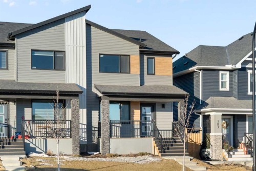 99 Edith Passage Nw, Calgary, AB - Outdoor With Facade