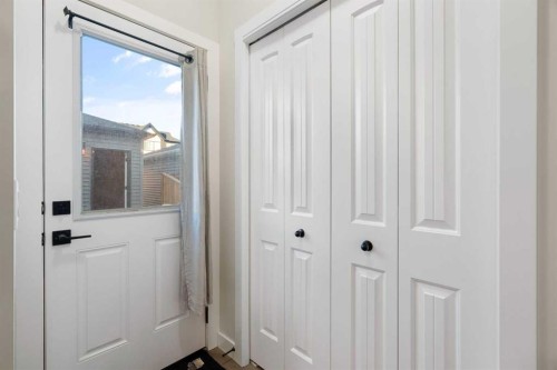 99 Edith Passage Nw, Calgary, AB - Indoor Photo Showing Other Room