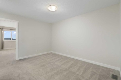 99 Edith Passage Nw, Calgary, AB - Indoor Photo Showing Other Room