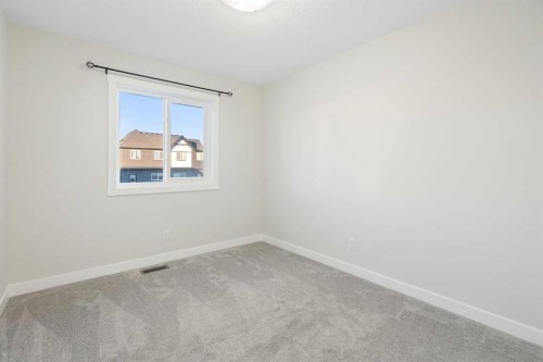 99 Edith Passage Nw, Calgary, AB - Indoor Photo Showing Other Room
