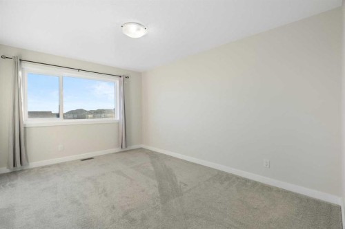 99 Edith Passage Nw, Calgary, AB - Indoor Photo Showing Other Room