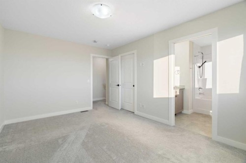 99 Edith Passage Nw, Calgary, AB - Indoor Photo Showing Other Room