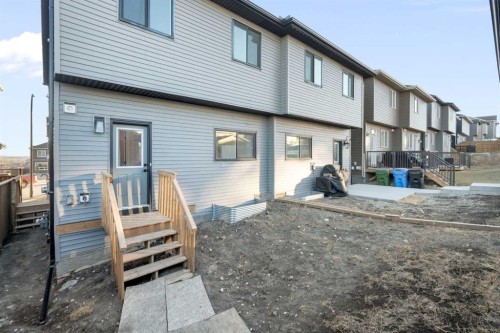 99 Edith Passage Nw, Calgary, AB - Outdoor With Exterior